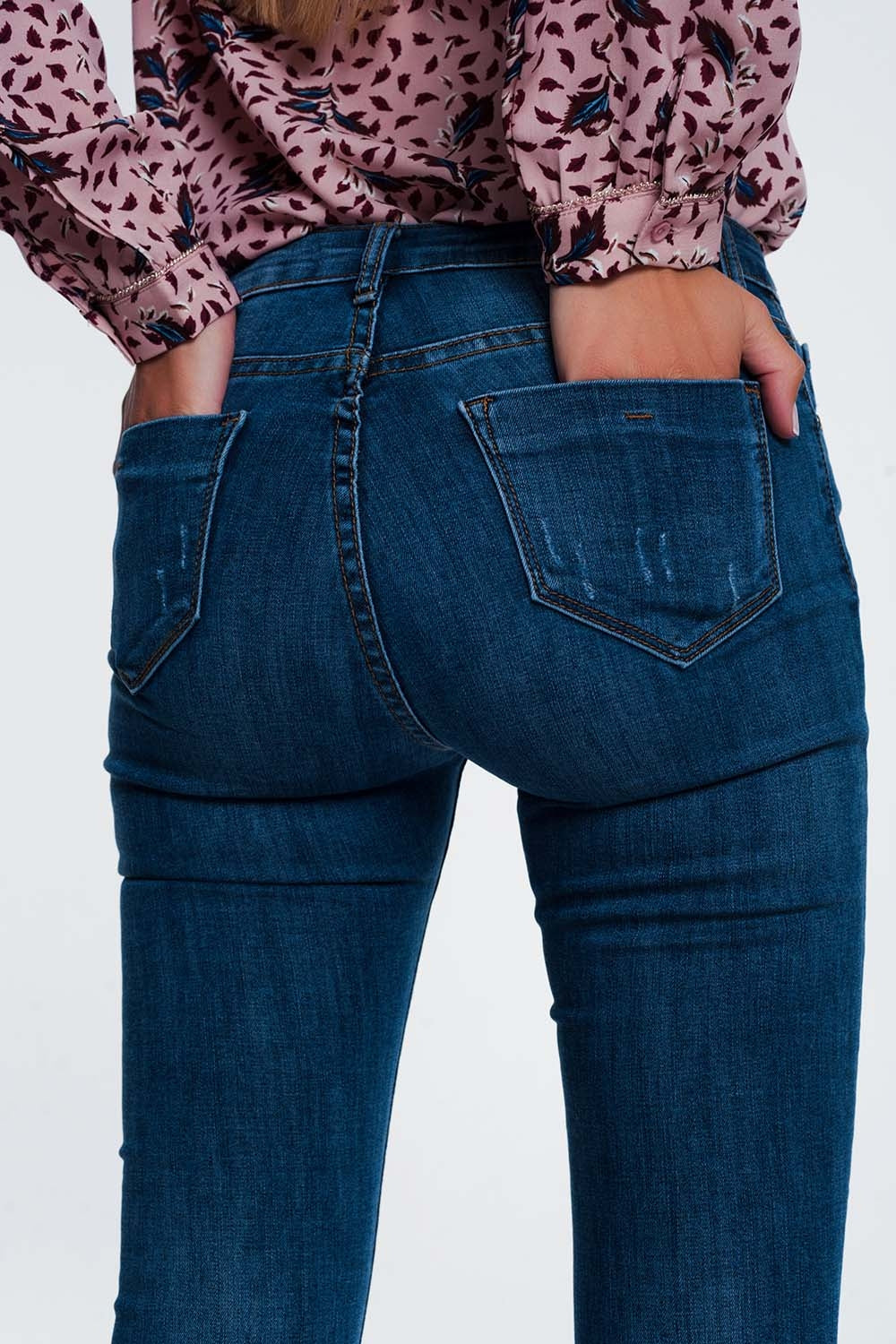 Jeans skinny strappati blu