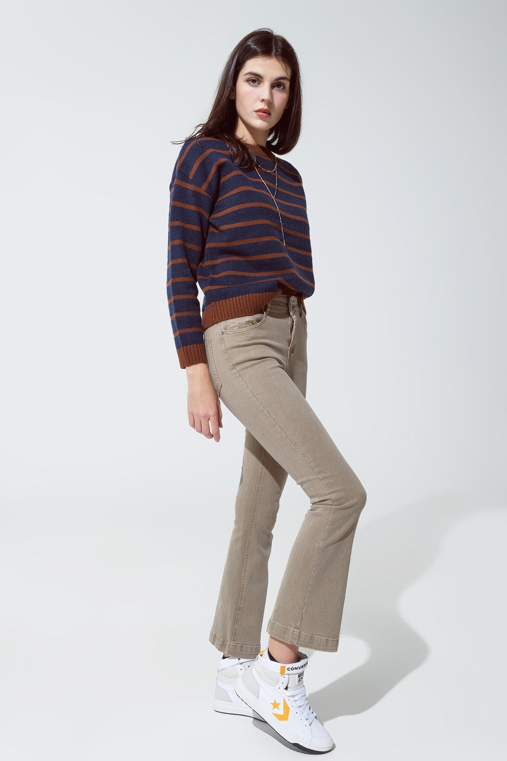 Jeans skinny svasati con doppio bottone in beige