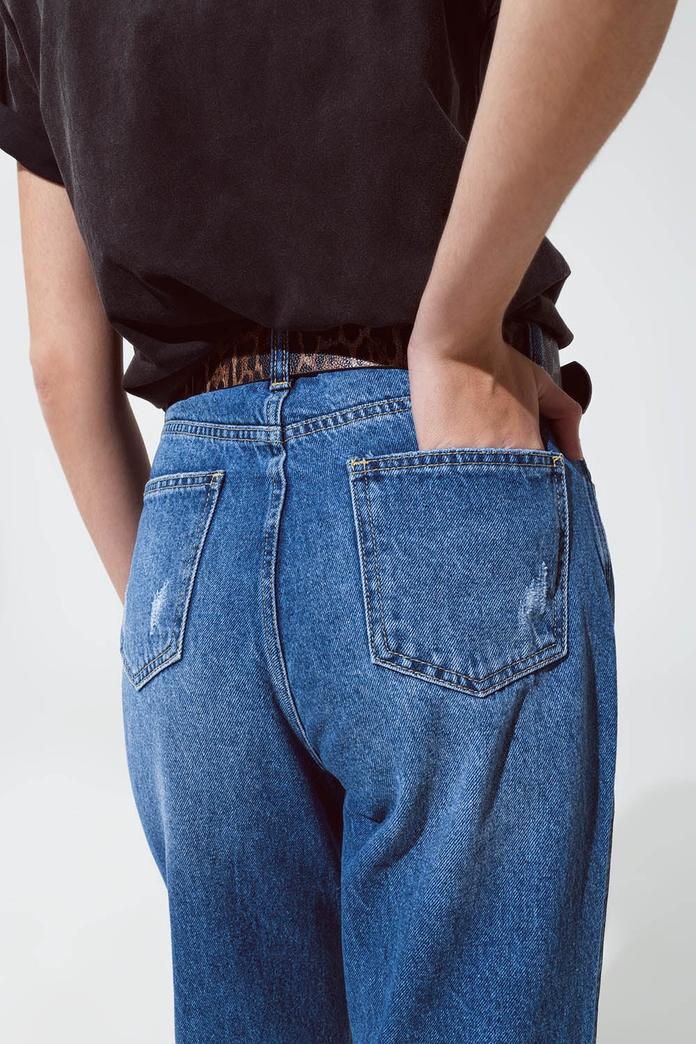 Jeans strappati a gamba dritta con bagliori metallici dorati