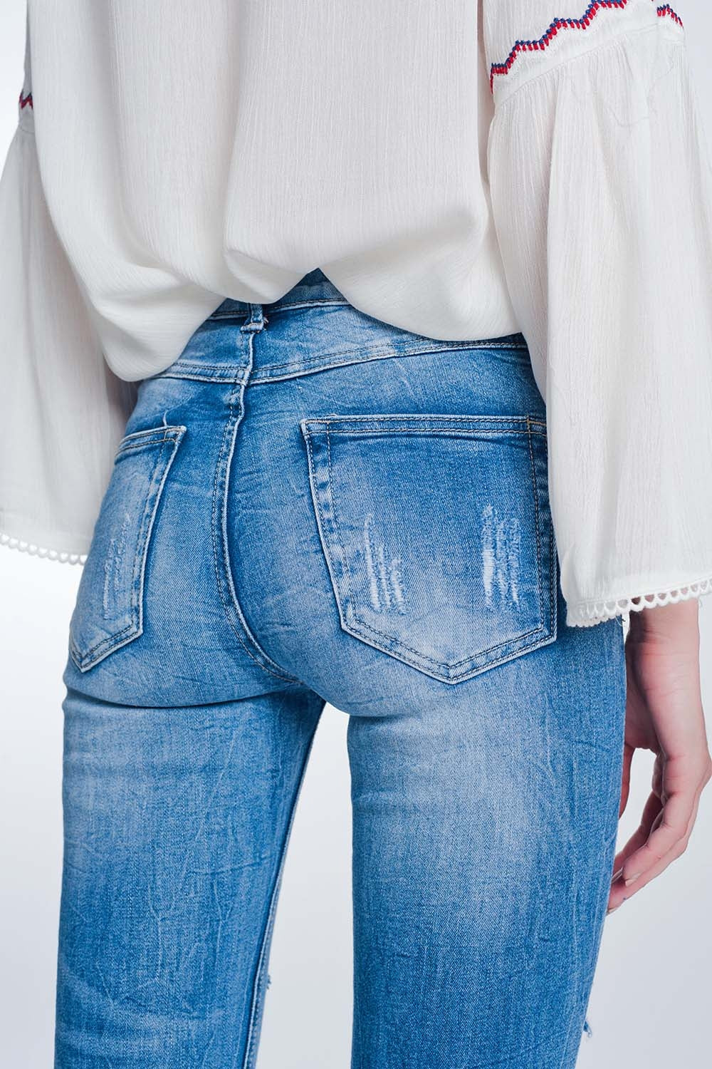 Jeans super skinny blu lavaggio vintage strappati