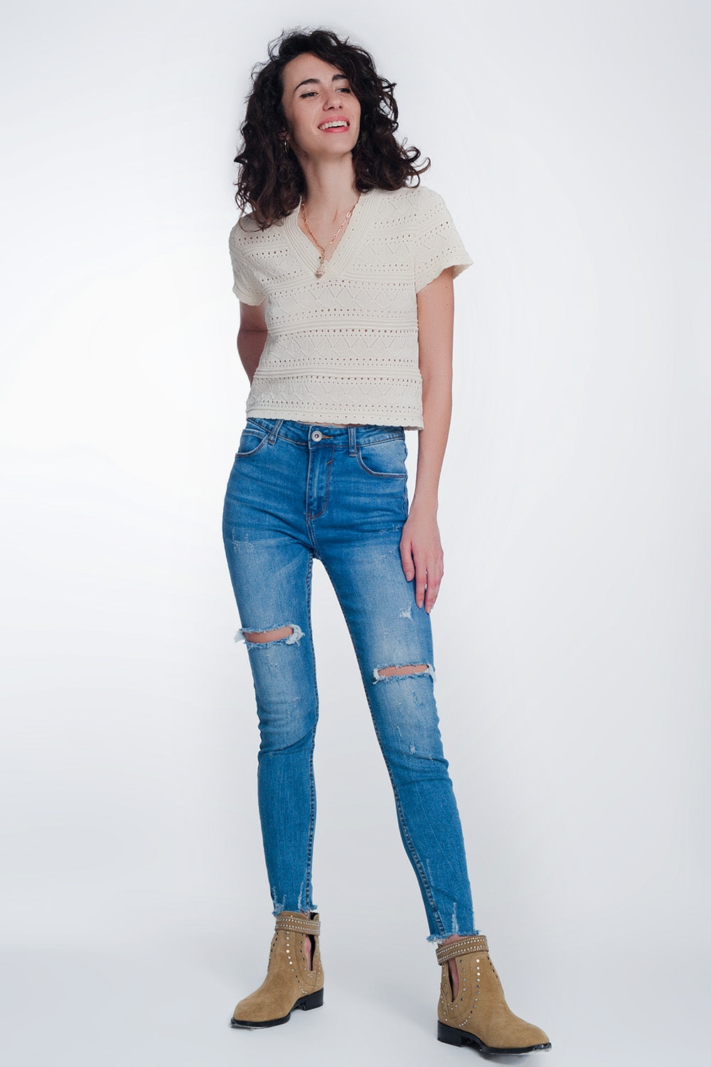 jeans super skinny con fori nelle ginocchia