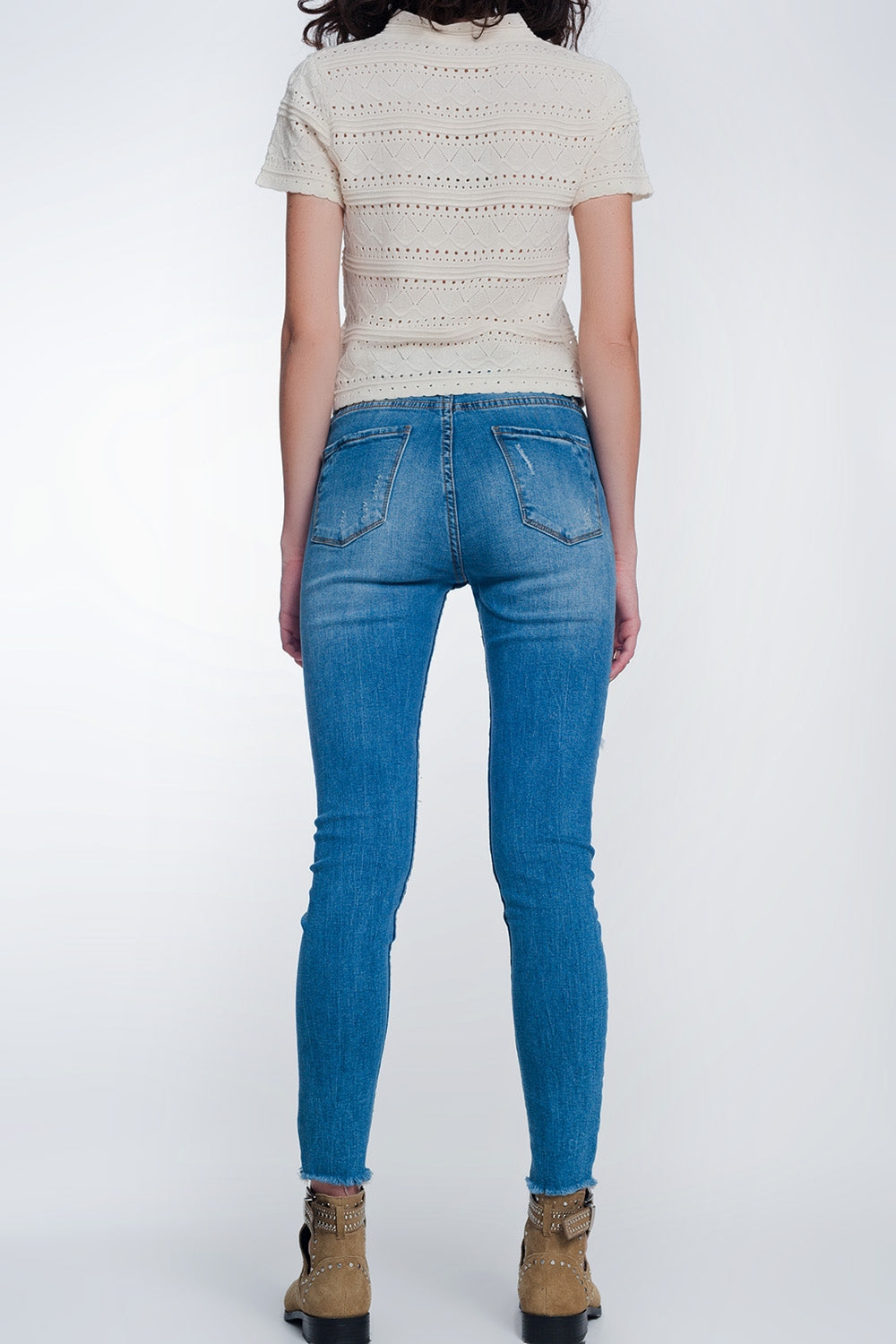 jeans super skinny con fori nelle ginocchia