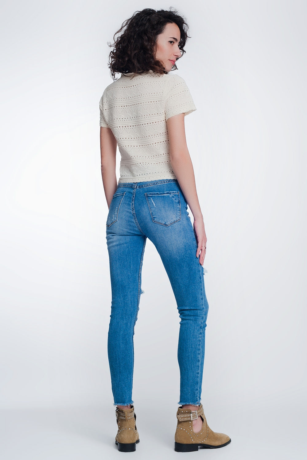 jeans super skinny con fori nelle ginocchia