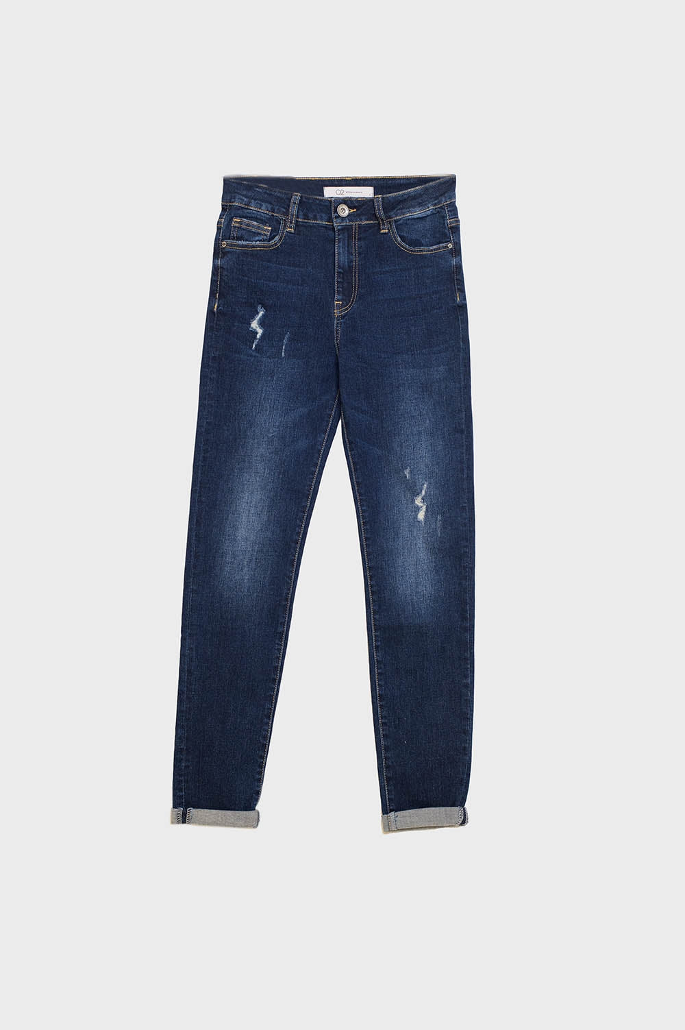 Jeans super skinny con lavaggio scuro e distressed in denim elasticizzato