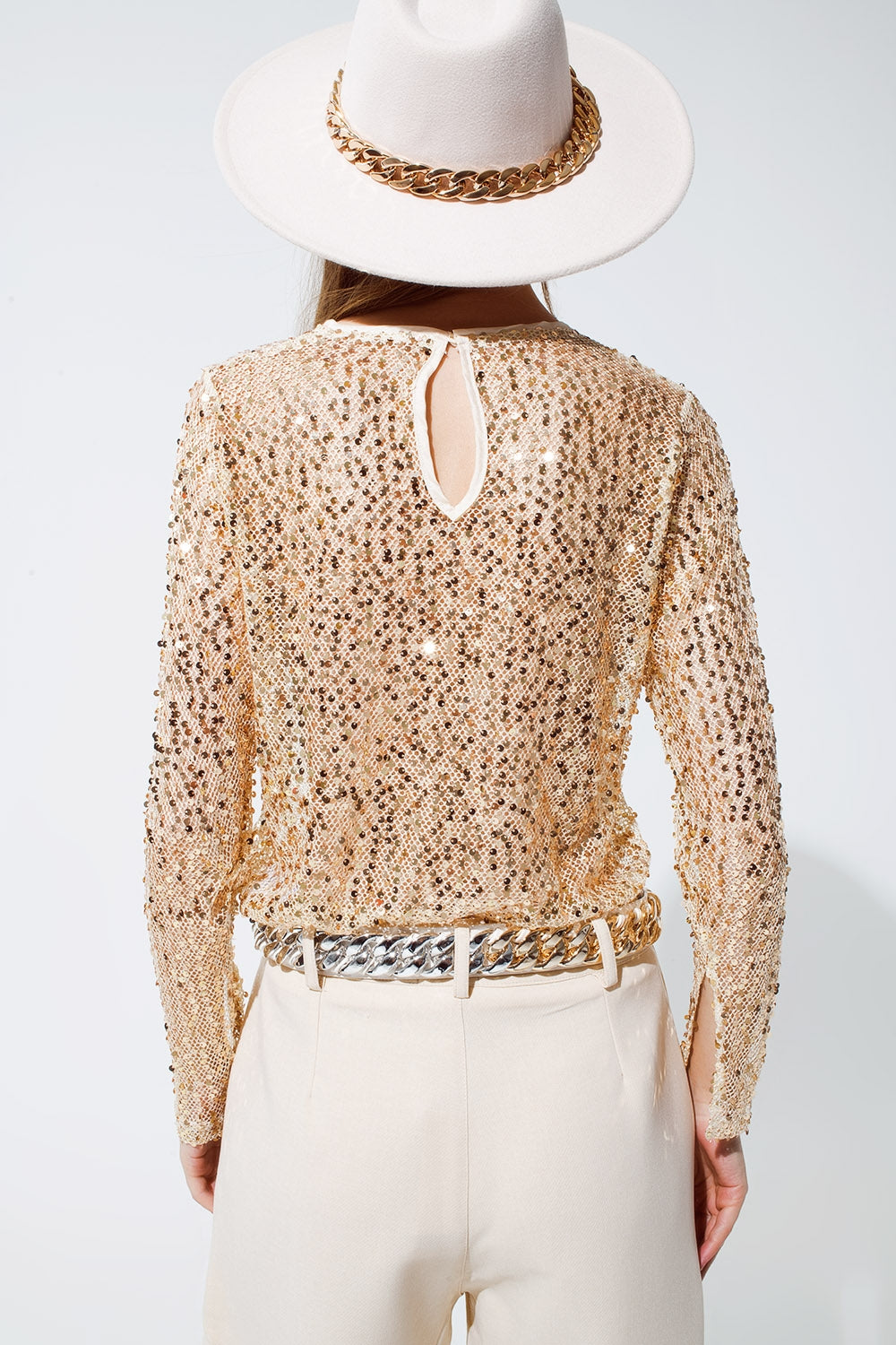Maglia a maniche lunghe con paillettes color oro