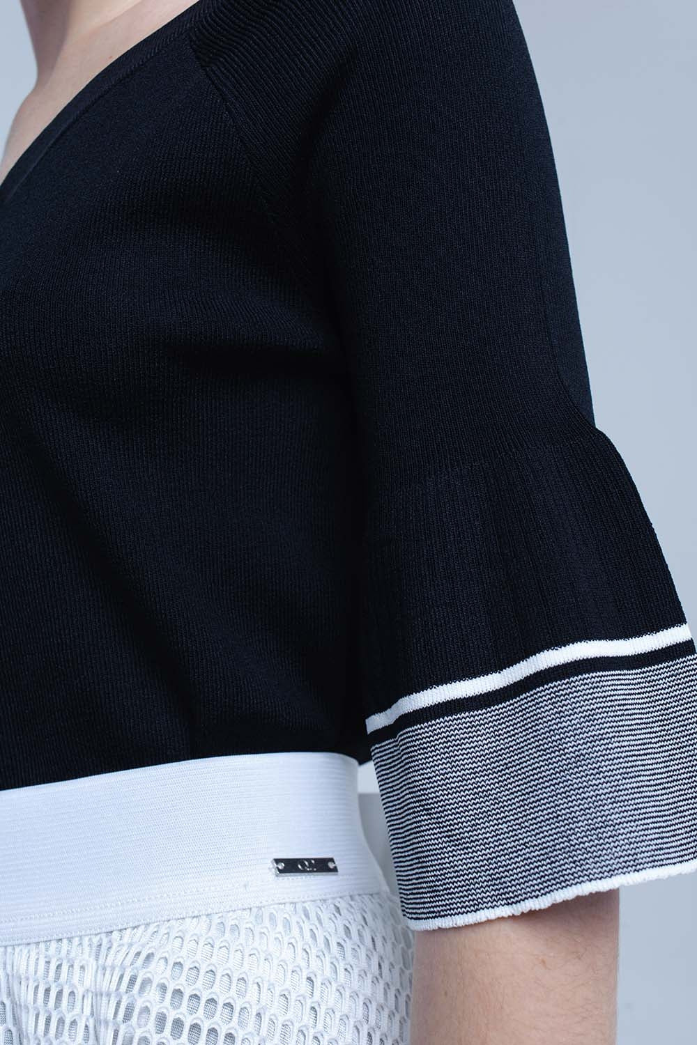 Maglia nera con manica a campana