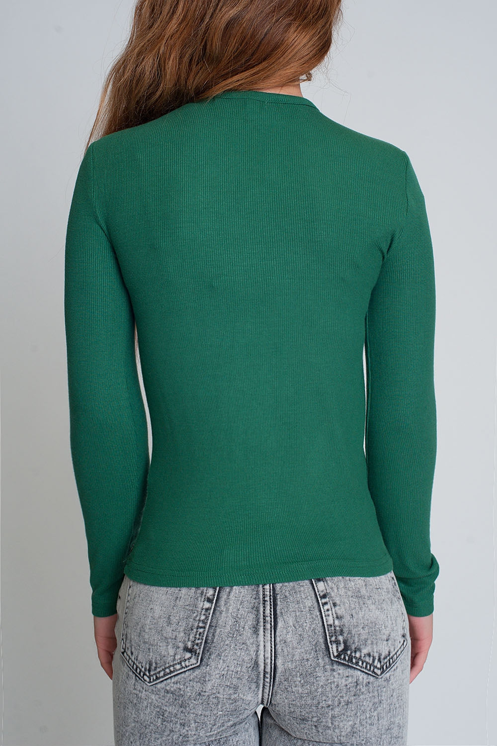 Maglione a collo asimmetrico in verde