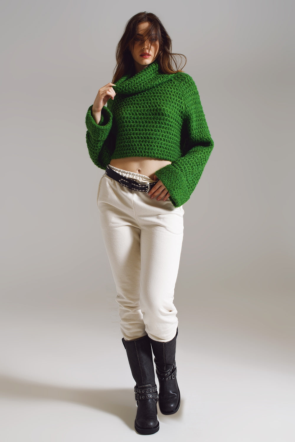 Maglione a coste con collo a dolcevita e polsini arrotolati in maglia a nido d'ape verde