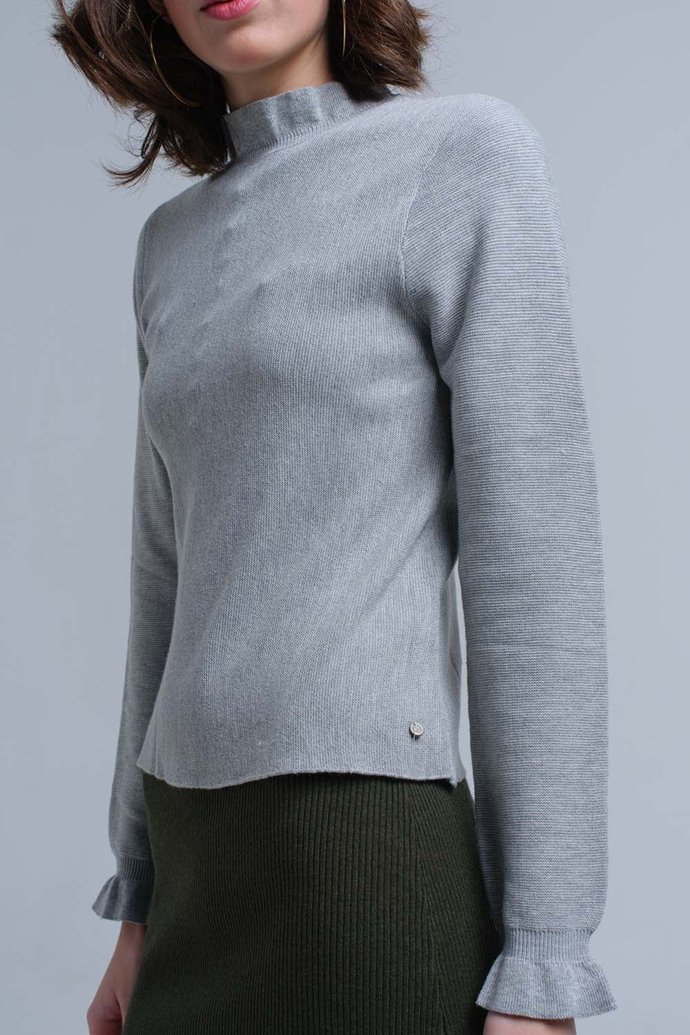 Maglione con volant di colore grigio
