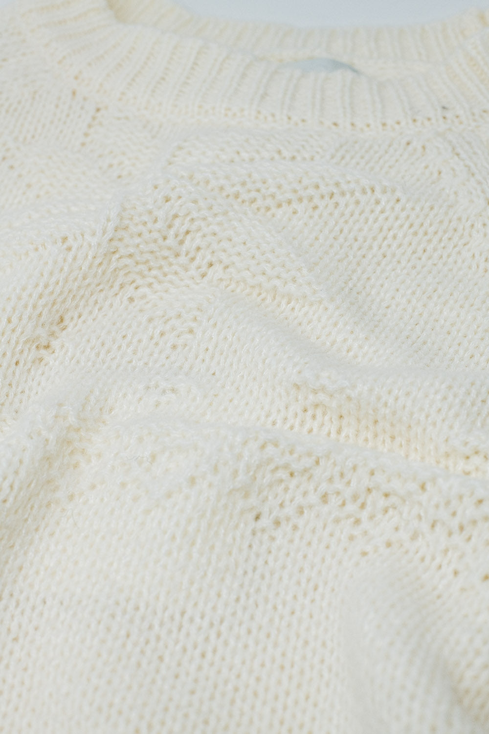 Maglione crema con dettagli natalizi