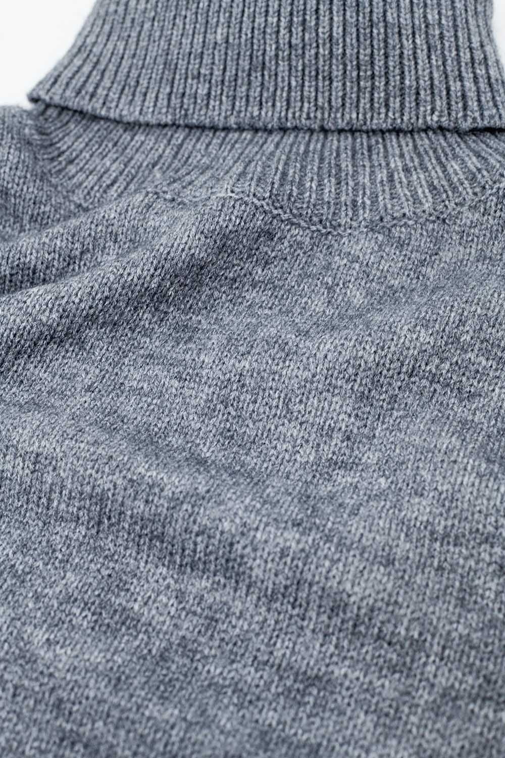 Maglione grigio con maniche scese