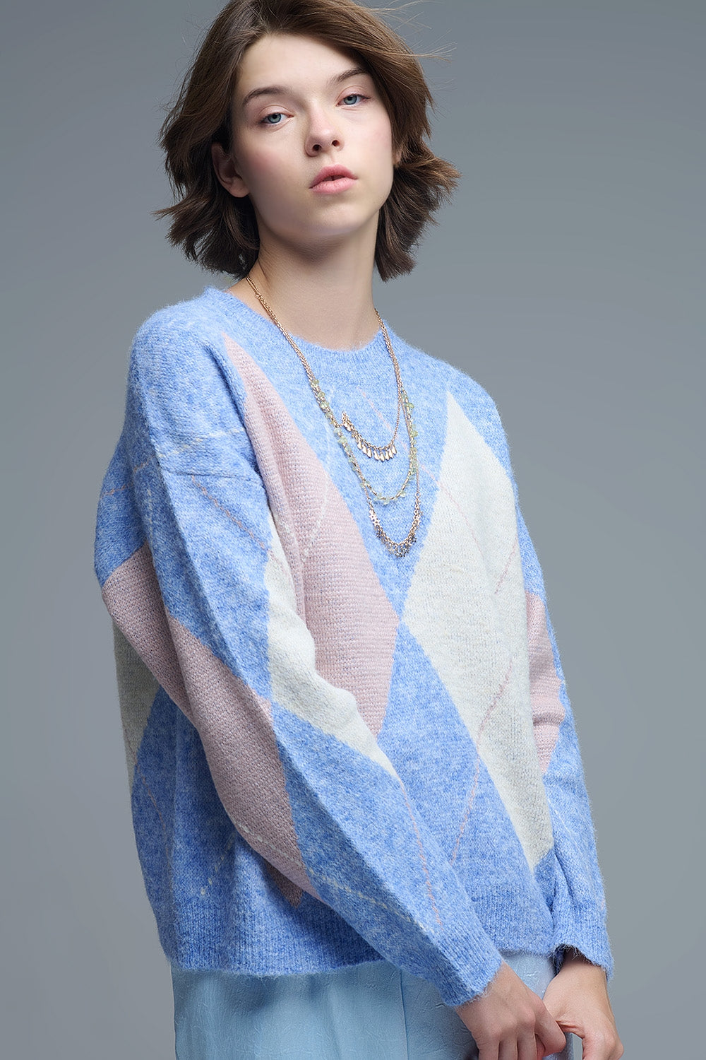 maglione largo in blu cielo con motivi a rombi