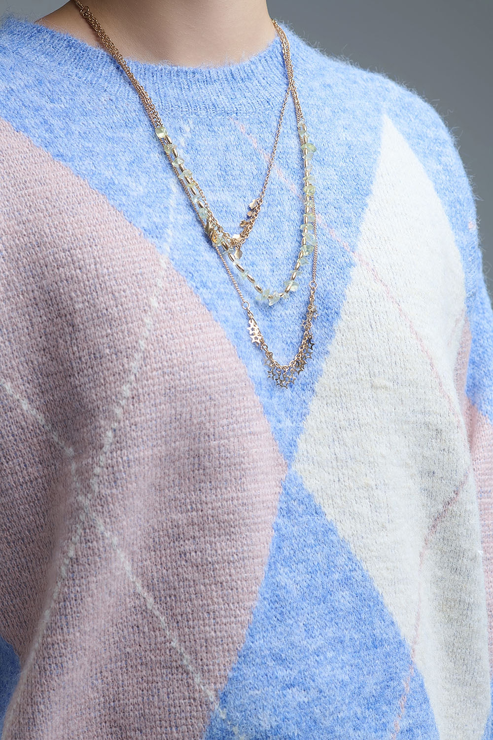 maglione largo in blu cielo con motivi a rombi