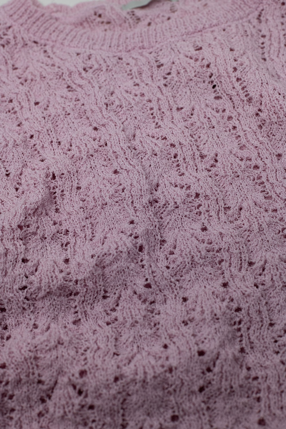 Maglione rosa con maniche svasate