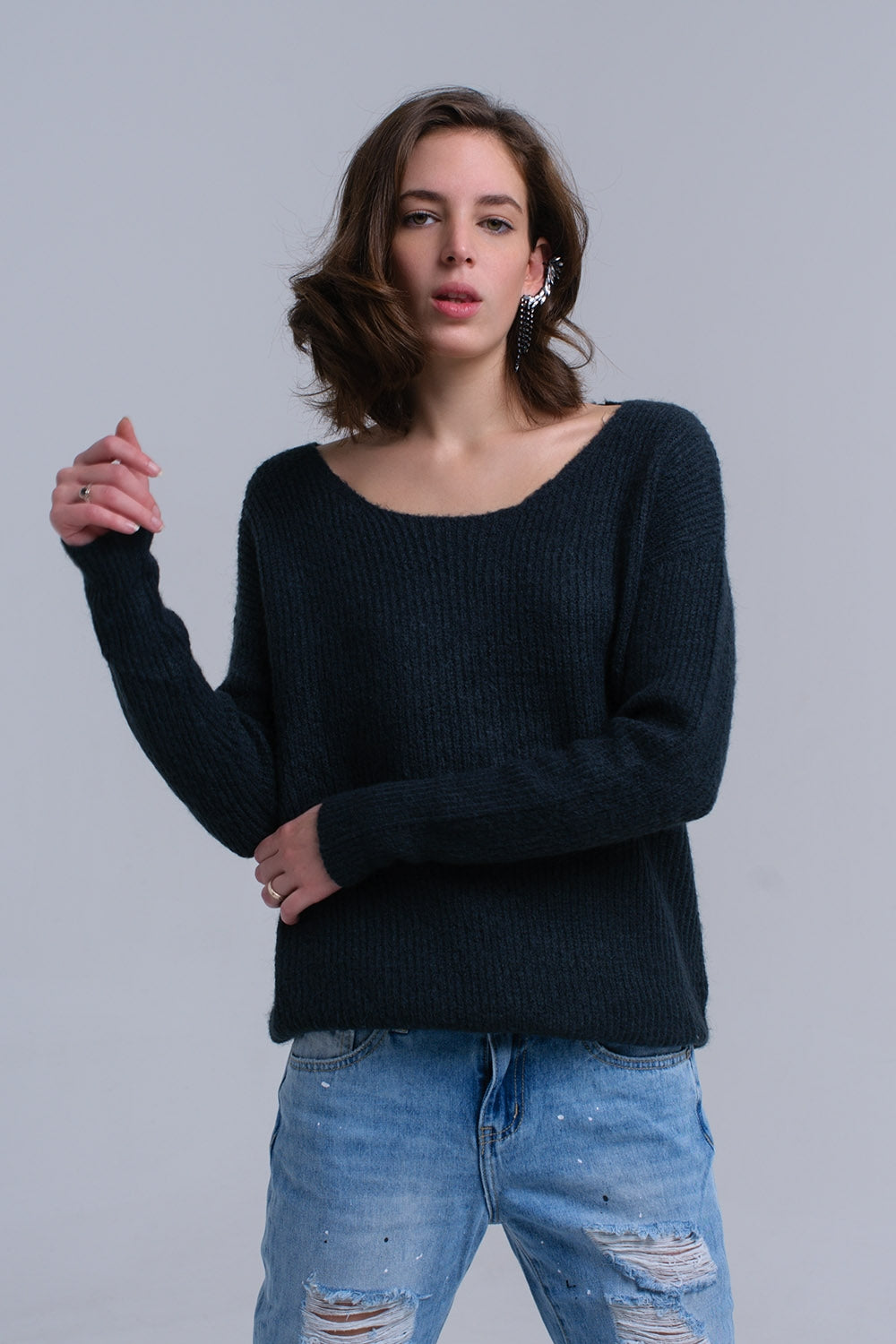 Maglione verde lavorato a maglia con chiusura a strappo