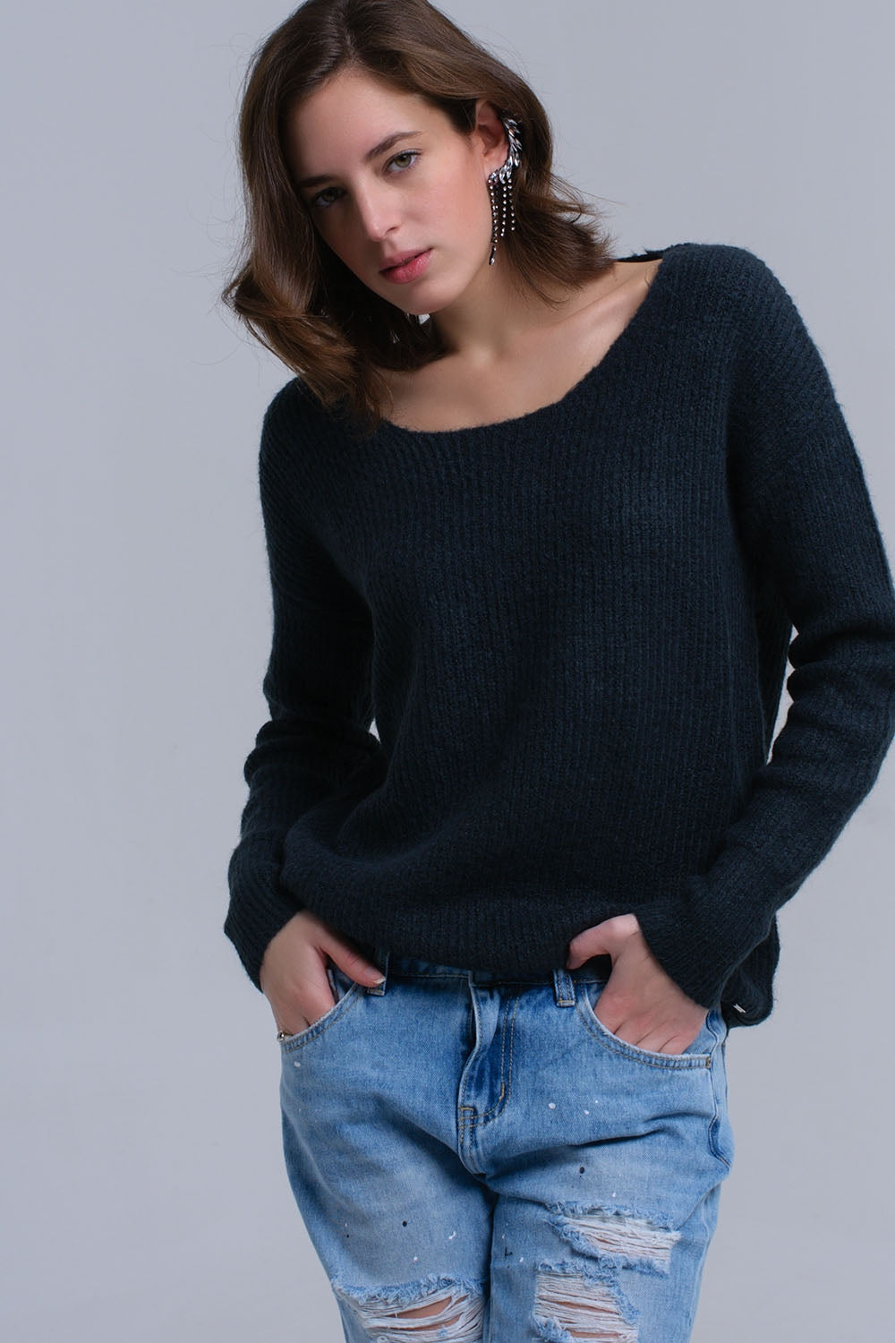 Maglione verde lavorato a maglia con chiusura a strappo
