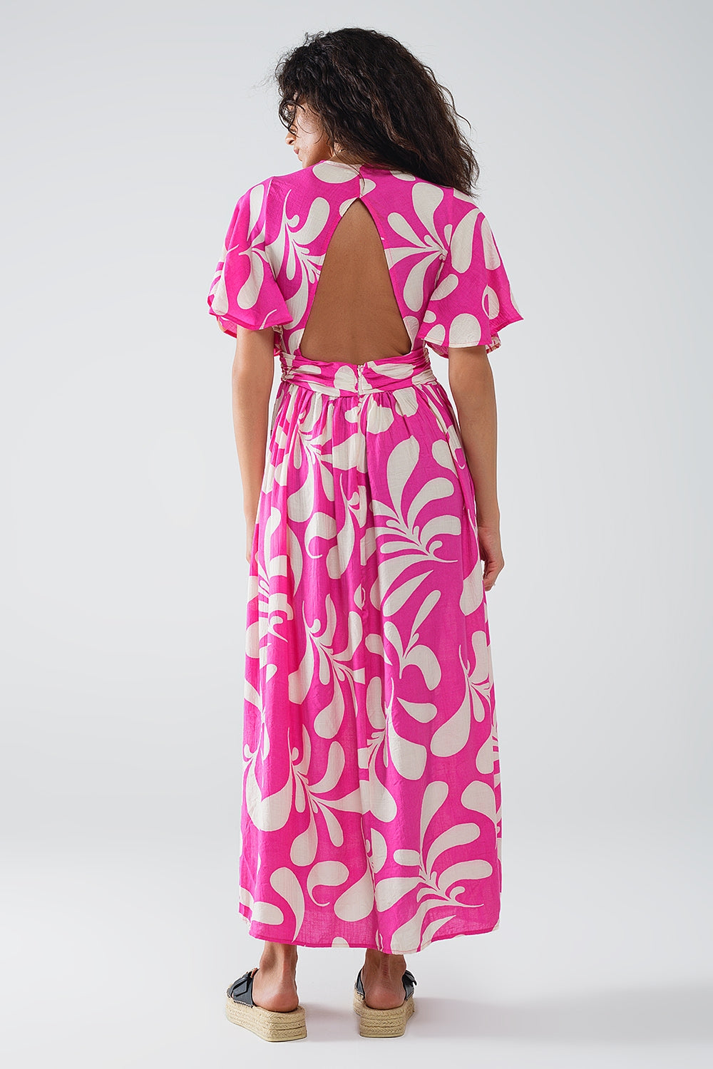 Maxi abito con stampa floreale fucsia e schiena scoperta