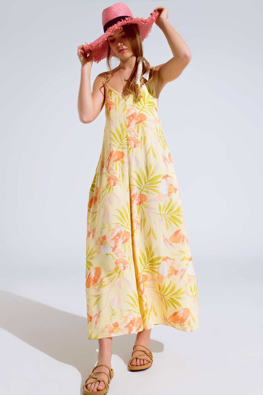 maxi tuta gialla con stampa tropicale