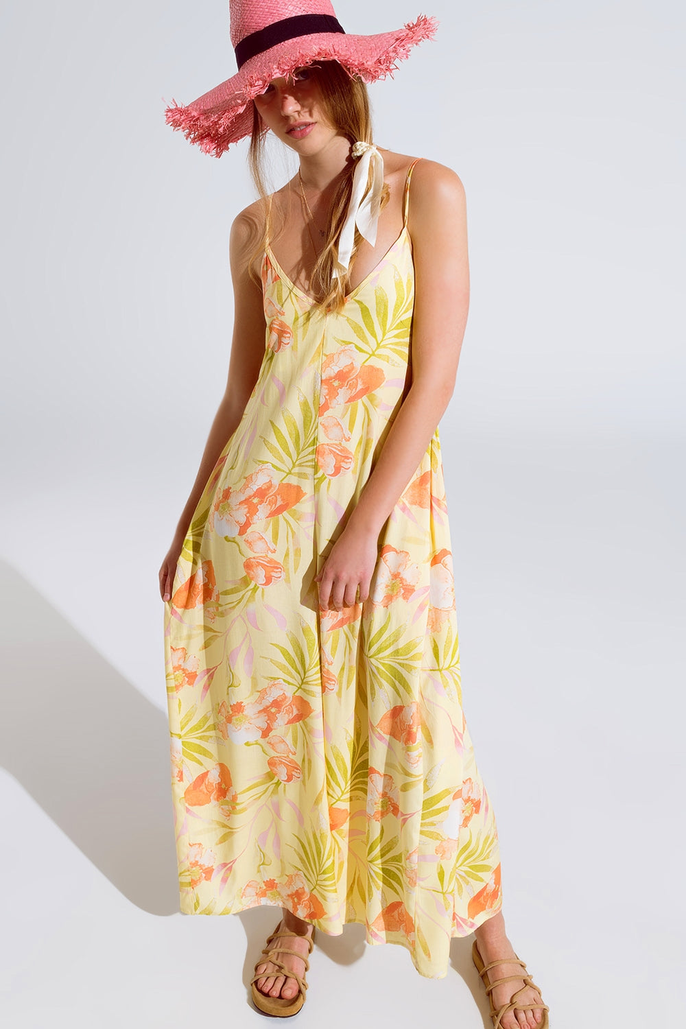 maxi tuta gialla con stampa tropicale