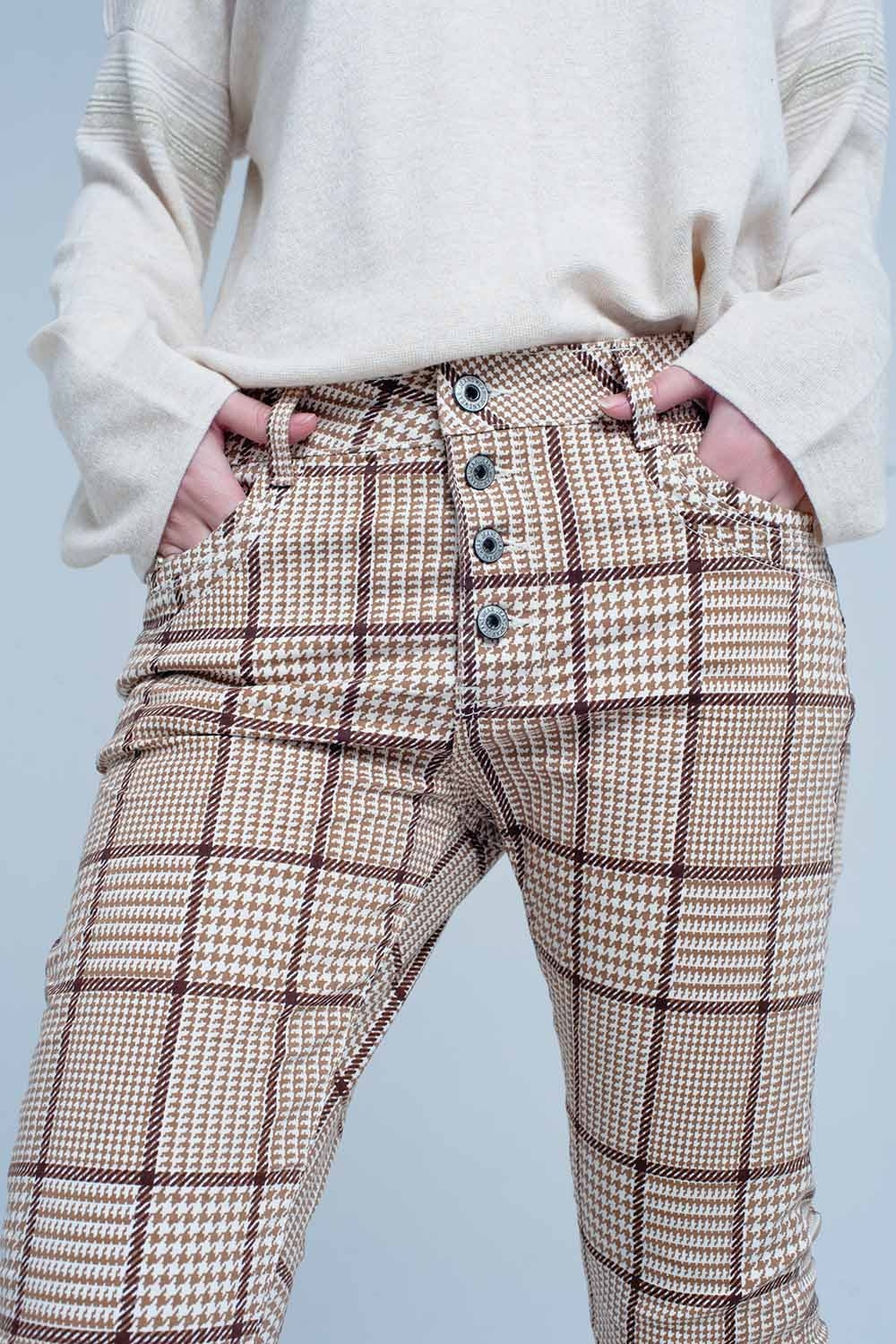 Pantaloni a quadri beige con pulsante