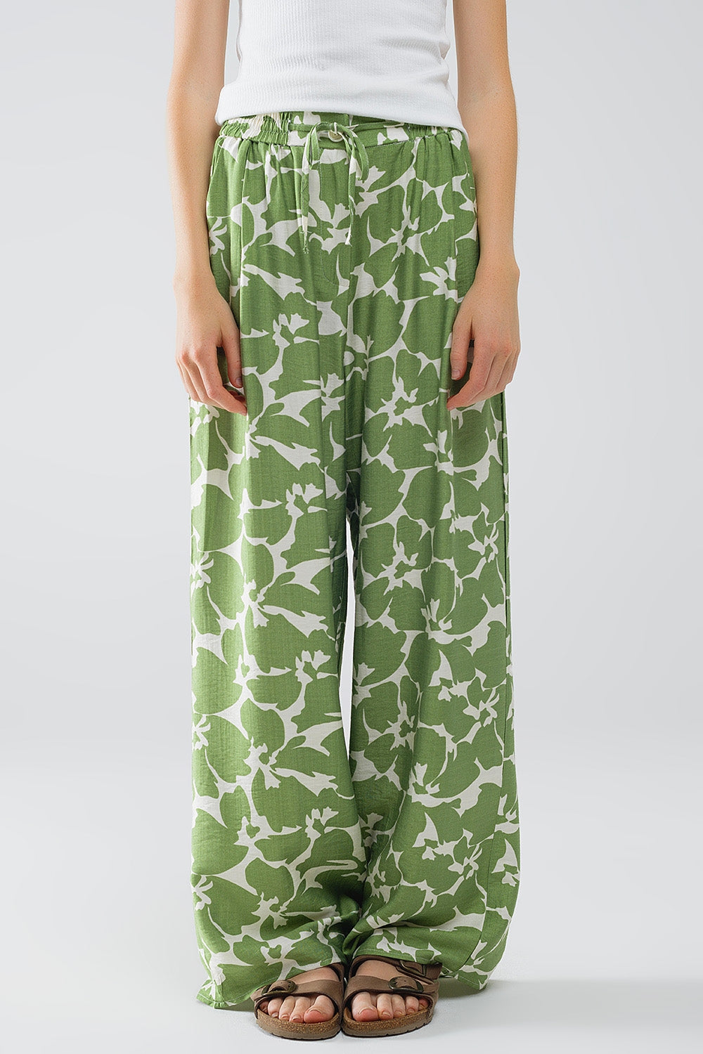 Pantaloni a zampa elasticizzati con stampa floreale verde