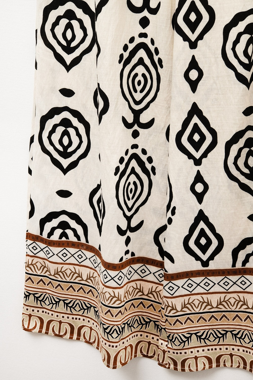 Pantaloni boho a gamba larga color crema con stampa