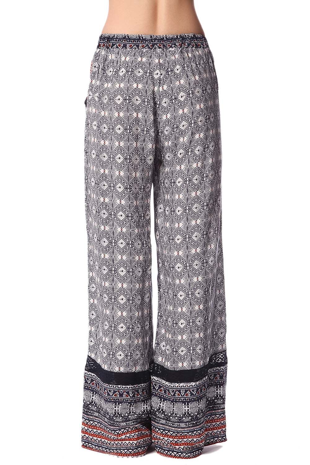 Pantaloni con fondo ampio blu con stampa etnica e inserto in pizzo