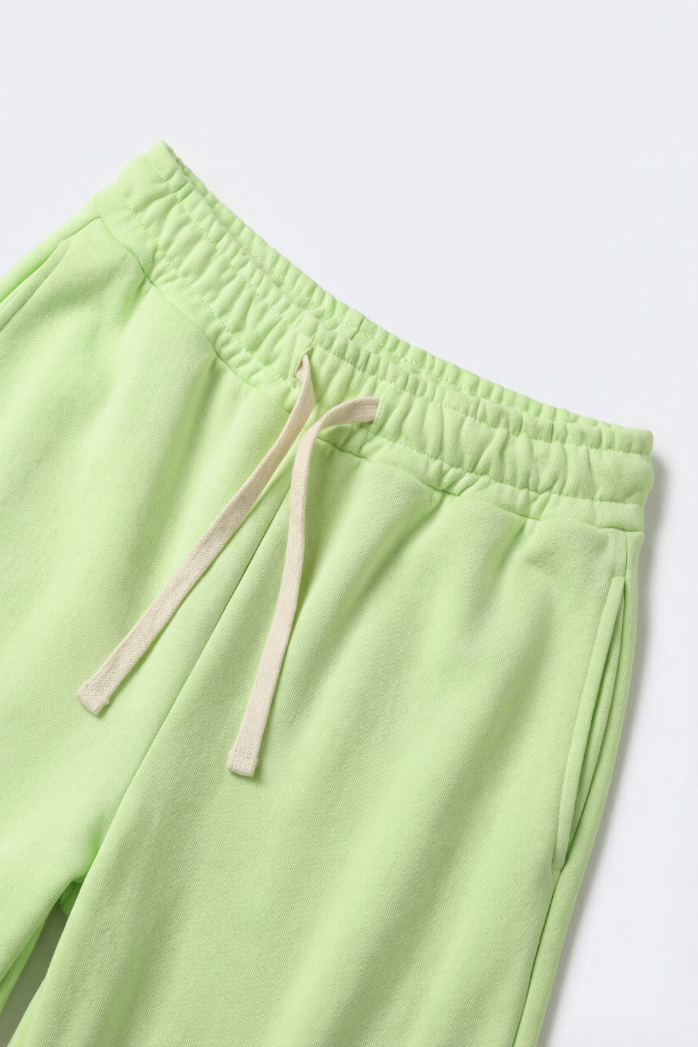 Pantaloni da ginnastica in maglia verde con elastico in vita e cravatta