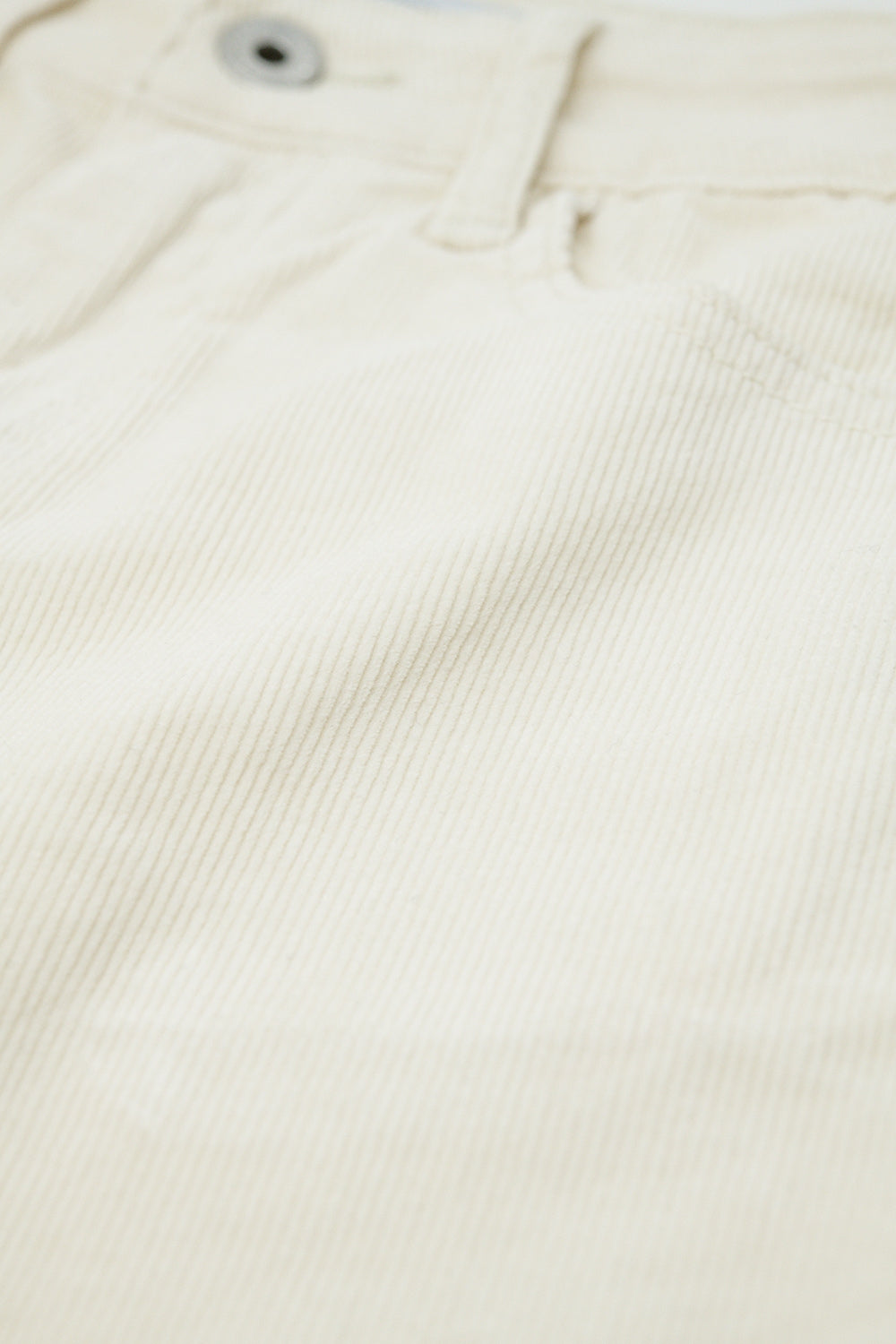 Pantaloni flare in velluto a coste beige chiaro con stampa leopardata sul fondo
