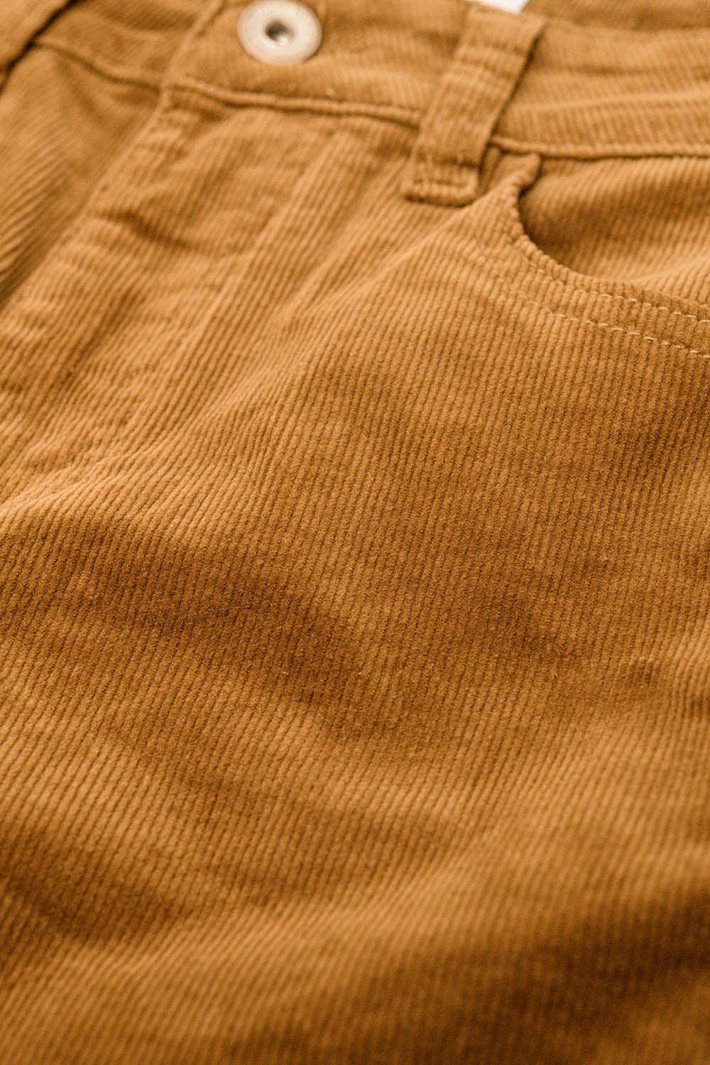 Pantaloni flare in velluto a coste marrone con stampa leopardata sul fondo