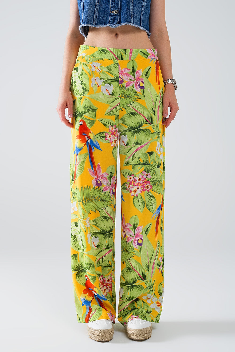 Pantaloni gialli con stampa tropicale e zip laterale