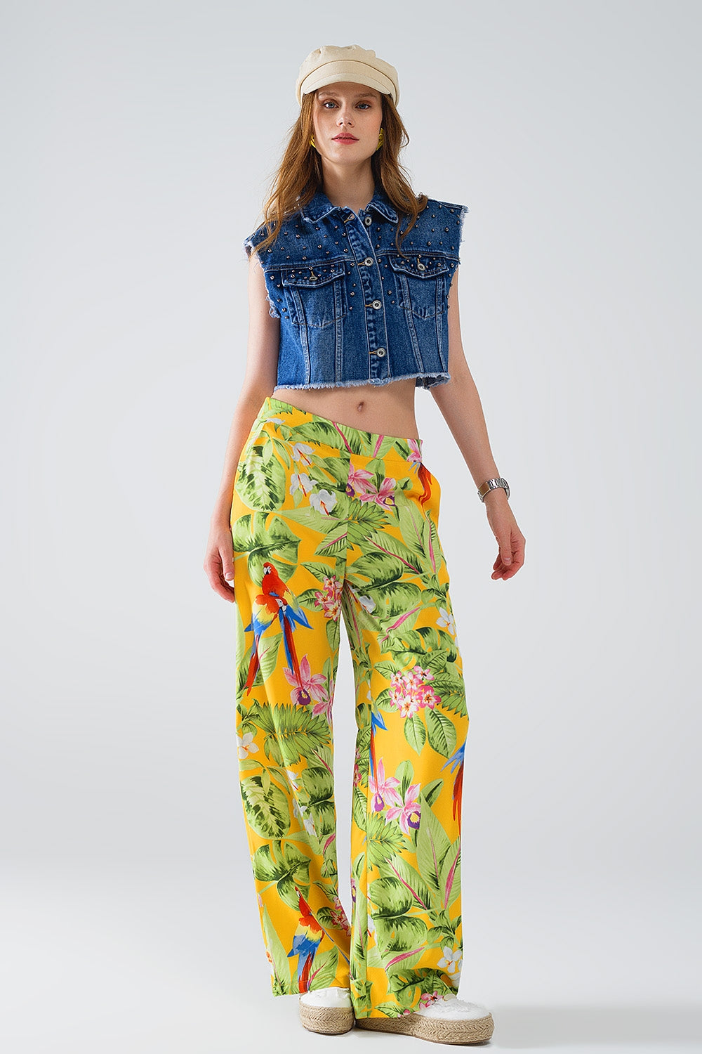 Pantaloni gialli con stampa tropicale e zip laterale