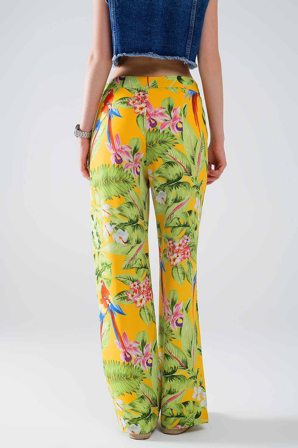 Pantaloni gialli con stampa tropicale e zip laterale