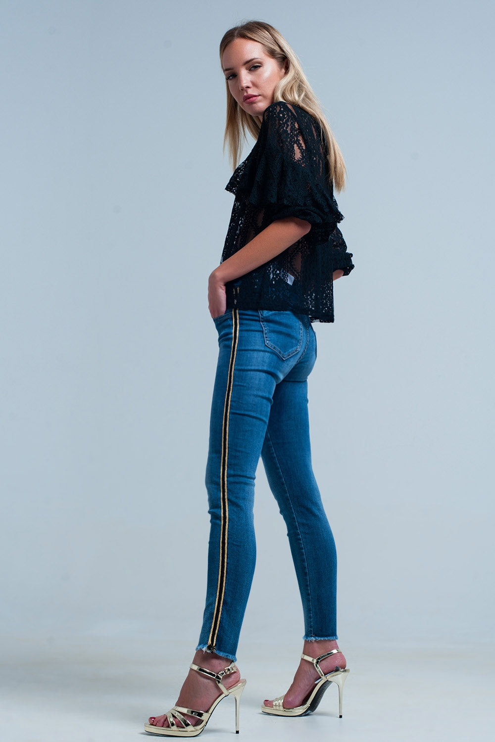 Pantaloni in denim blu con fascia laterale dorata e nera