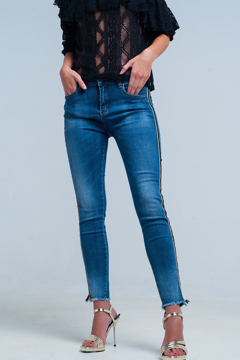 Pantaloni in denim blu con fascia laterale dorata e nera