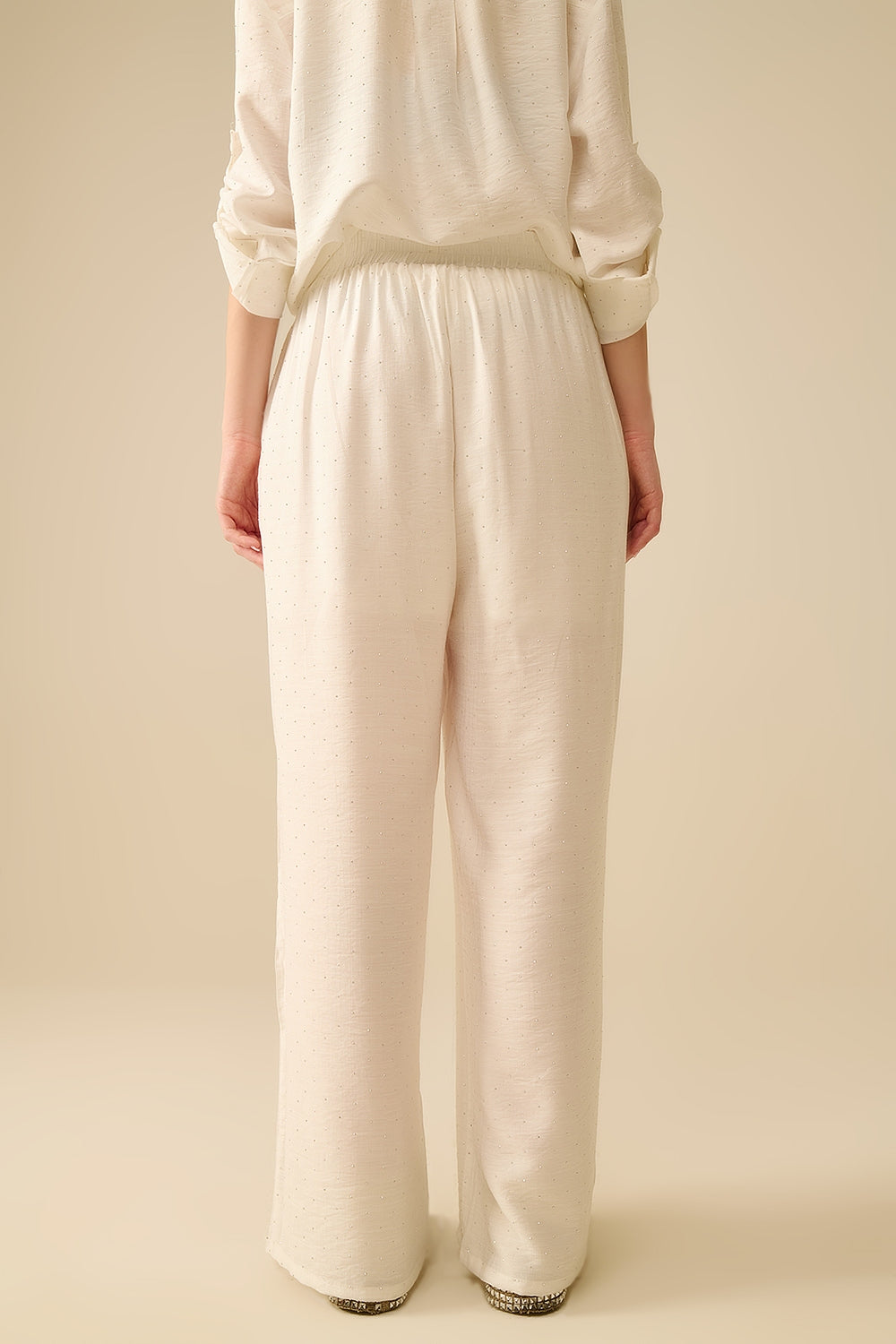 Pantaloni leggeri a gamba larga bianchi con dettagli in strass