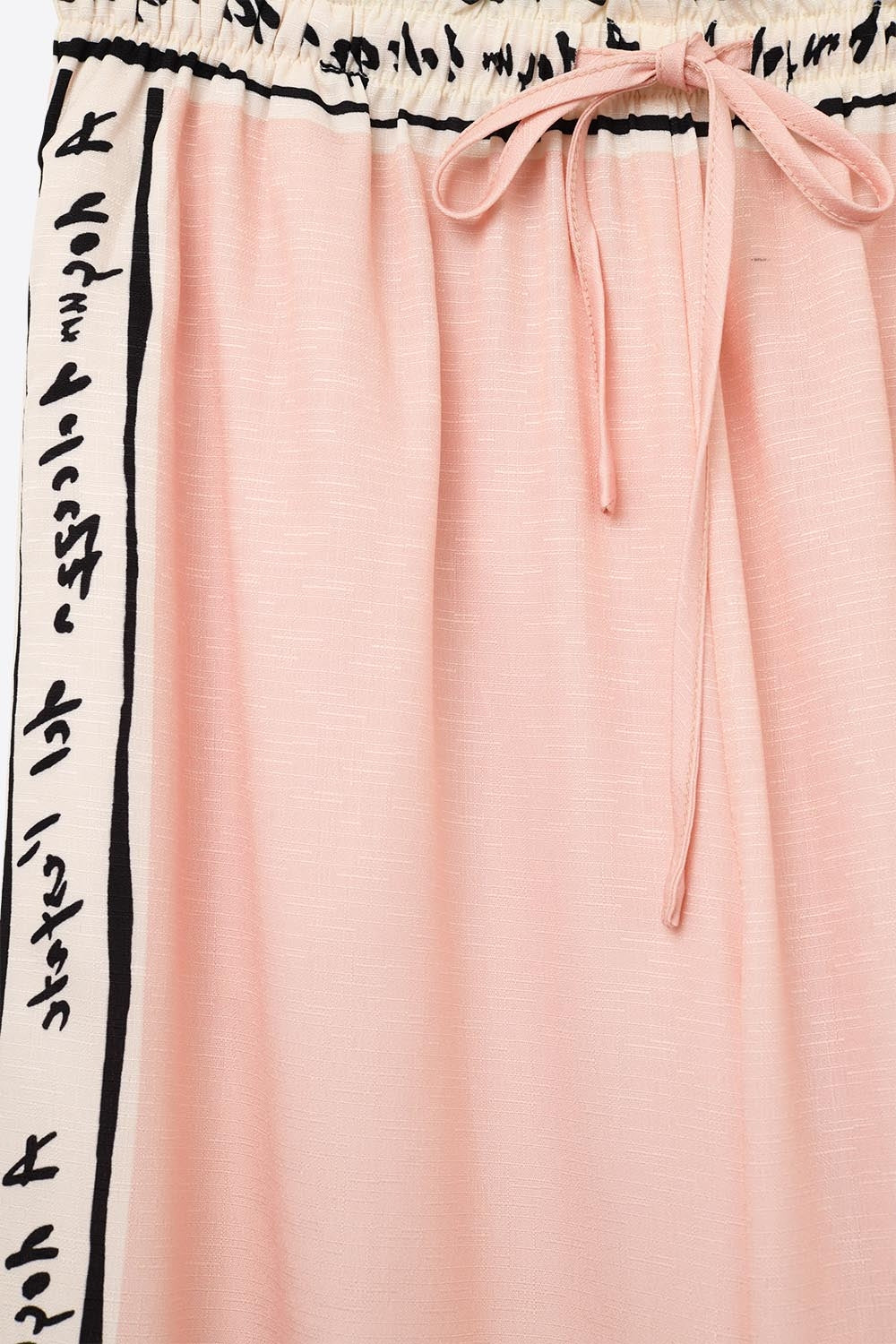Pantaloni rosa con stampa acquerello estivo