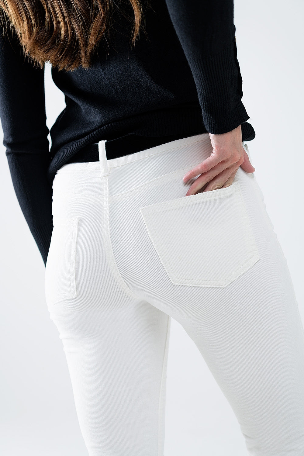 Pantaloni svasati in velluto a coste color crema con stampa leopardata in basso
