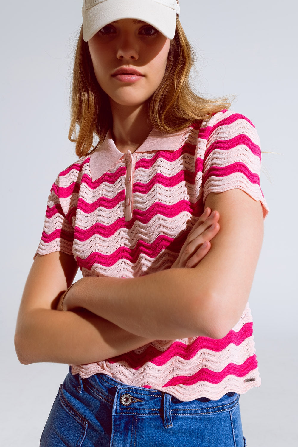 Polo rosa con righe ondulate fucsia