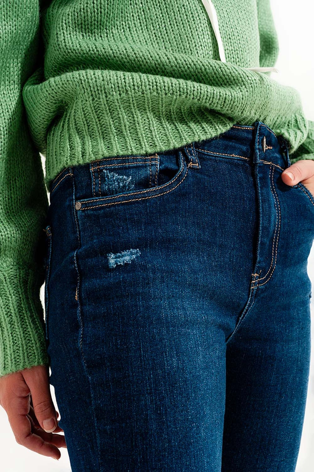 Skinny jeans tono blu medio con risvolti elasticizzato