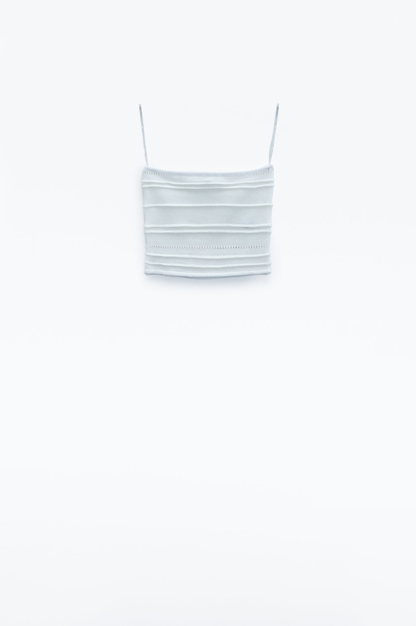 Top bodycon in maglia senza spalline in bianco
