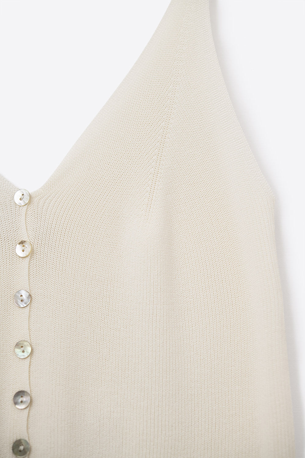 top corto beige in maglia con bottoni