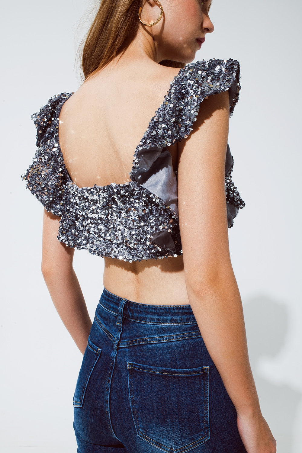Top corto glitterato con paillettes color argento