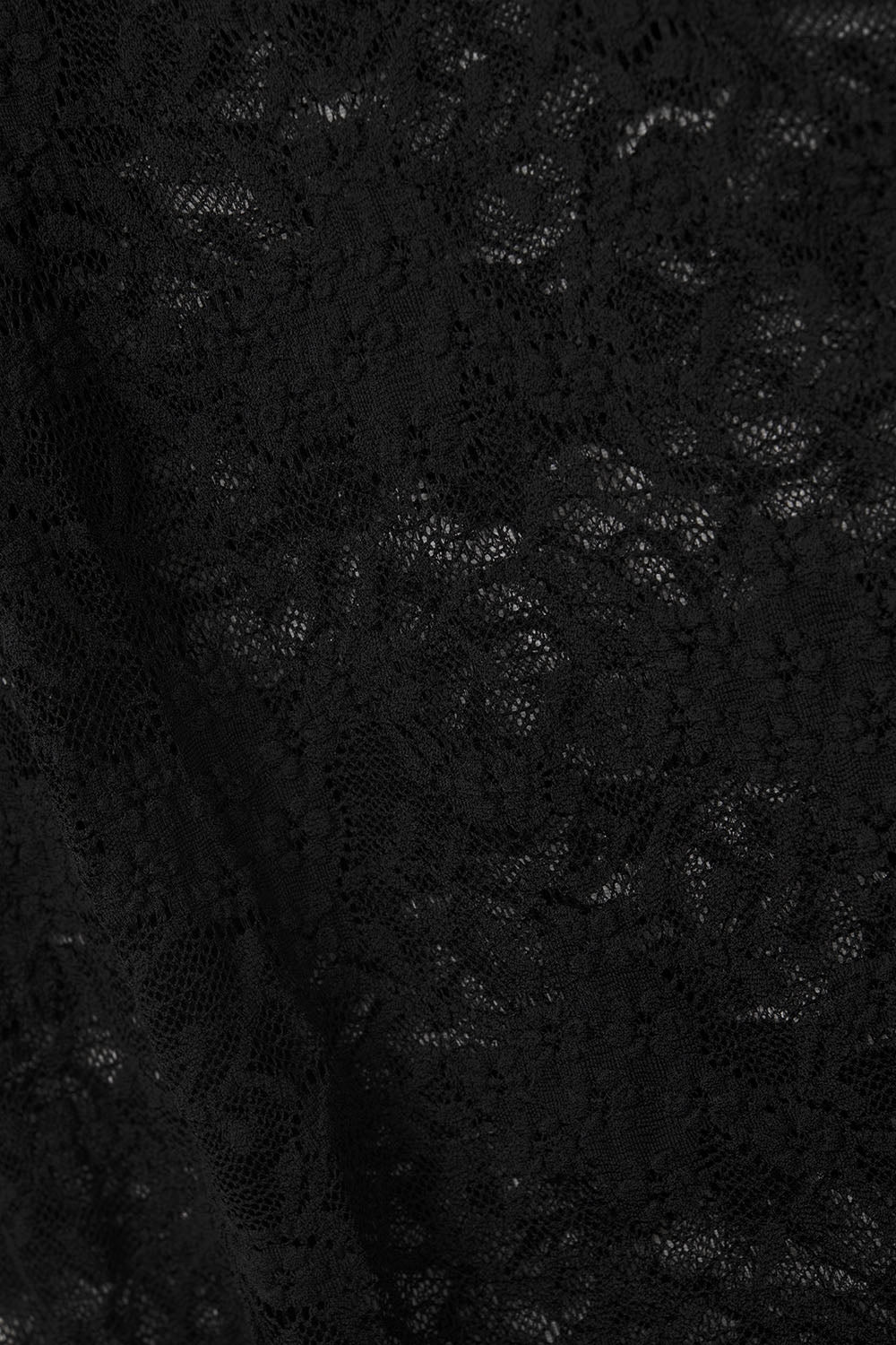 Top in pizzo nero con maniche lunghe a campana e volant