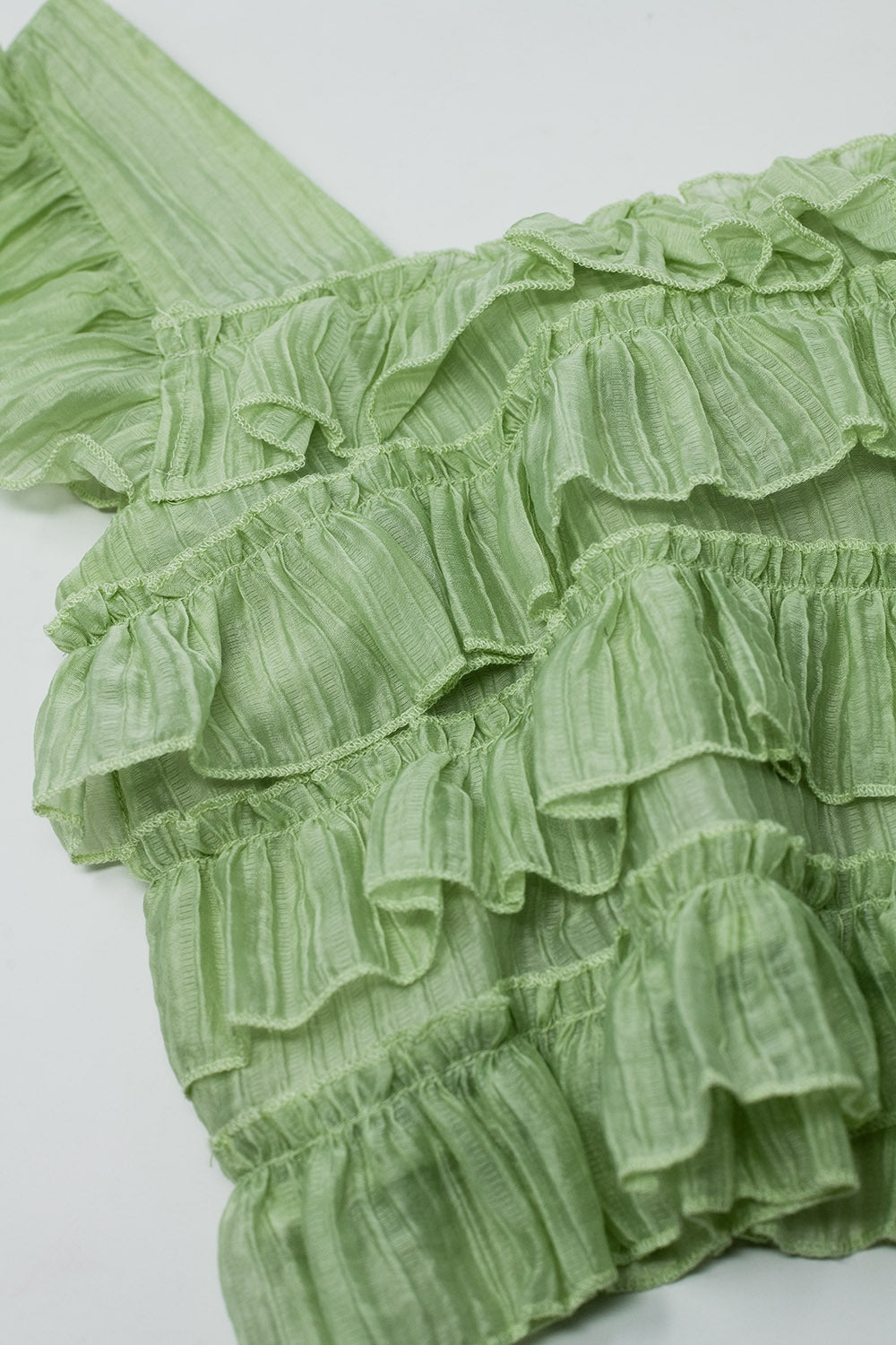 Top senza maniche verde con increspatura