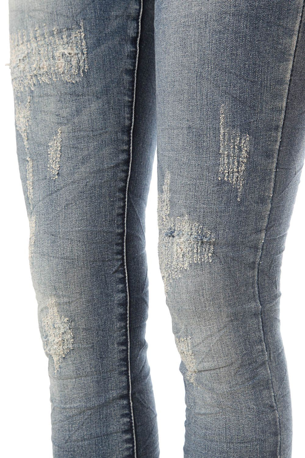 Jeans cigarrette con effetto consumato