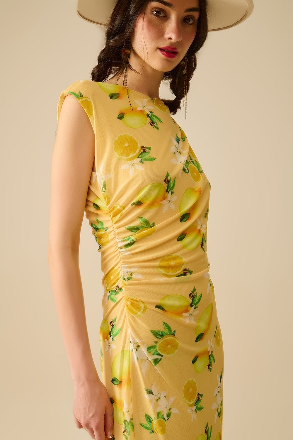 Abito in tulle con balza laterale con stampa giallo limone