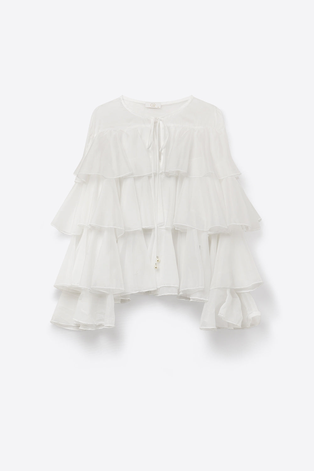 Blusa bianca con volant a strati e peplo con fiocco al collo