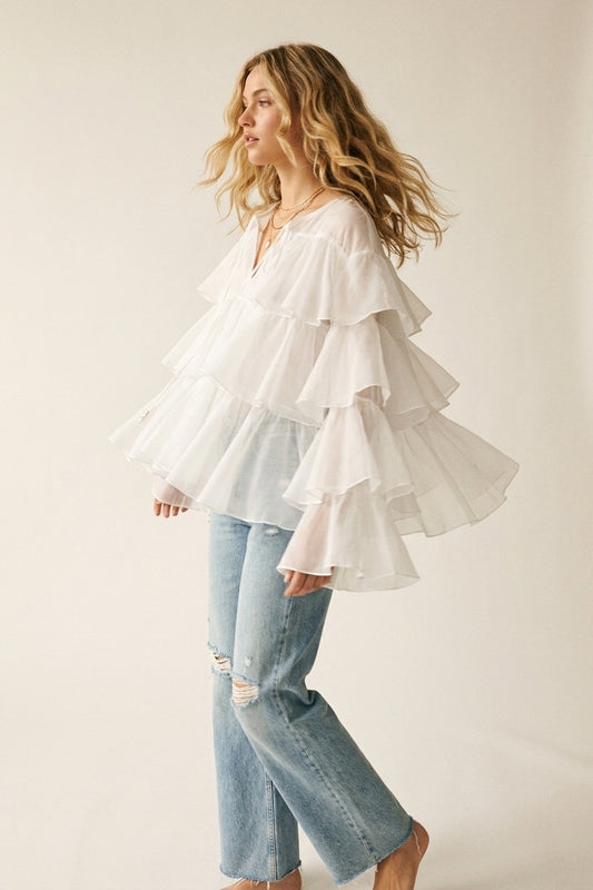 Q2 Blusa bianca con volant a strati e peplo con fiocco al collo