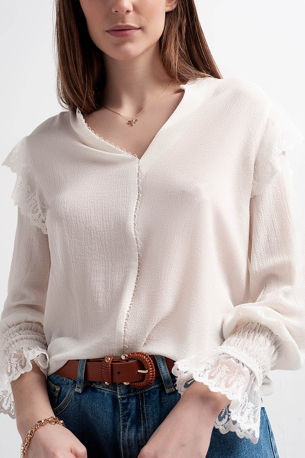 Blusa con maniche voluminose con polsini color ostrica